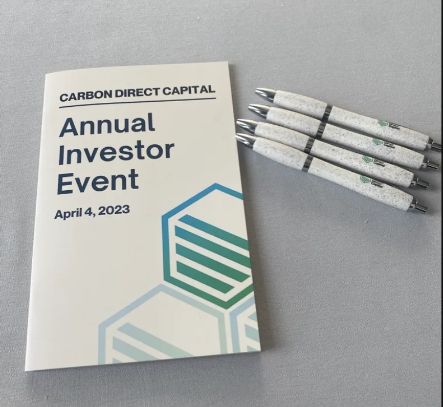 Carbon Direct Capital Annual Investor Event program booklet with branded pens, NYC event materials by EMRG Media